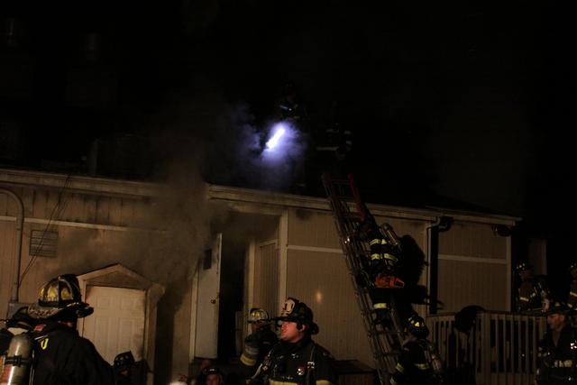 Mutual aid Katonah Old Deer Park Fire. Members going to the roof to vent